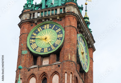 Clock tower of old historic brick town hall in Gdansk