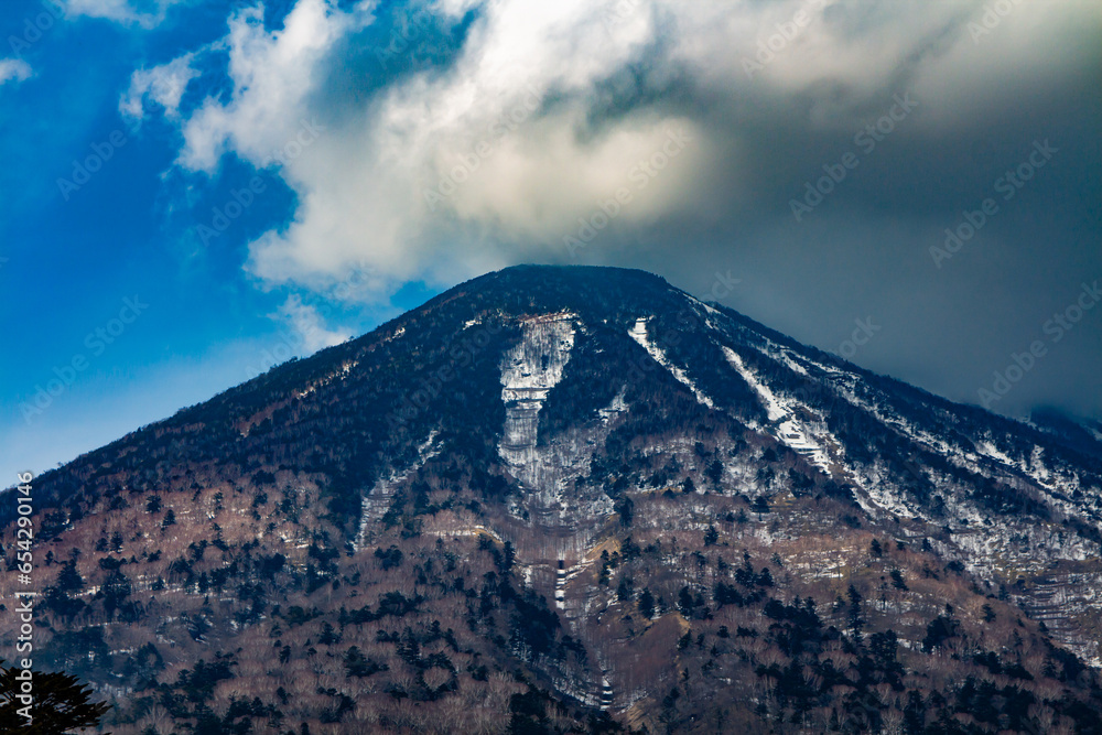 a view of the summit of mount nantai in nikko in early spring