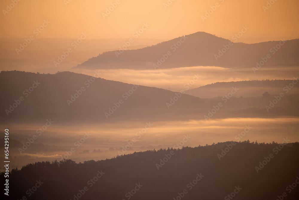 Mist-Covered Mountain Range at Sunrise