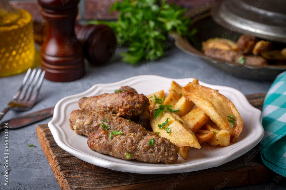 Traditional Turkish food; dry meatballs or inegöl meatballs with potatoes (Turkish name; Kuru kofte or anne koftesi) Traditional Turkish food; dry meatballs or inegöl meatballs with potatoes (Turkish name; Kuru kofte or anne koftesi)
