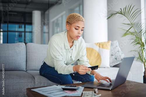 Budget, bills and woman with laptop and credit card for payment, information or application with fintech at home. Finance management, online shopping and savings, customer and account subscription
