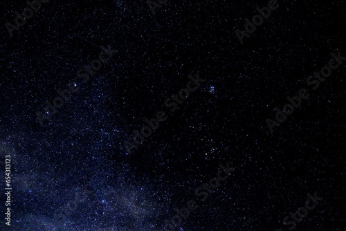 Fototapeta Naklejka Na Ścianę i Meble -  Starry Night: A canvas of the universe painted with twinkling stars, illuminating the night sky with its celestial wonders.