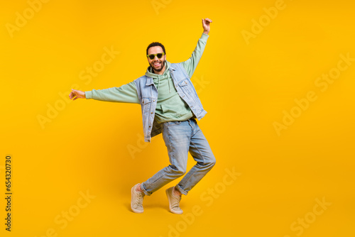 Full body size cadre of funky crazy cheerful macho playful dance have fun tiptoes have fun positive isolated on yellow color background