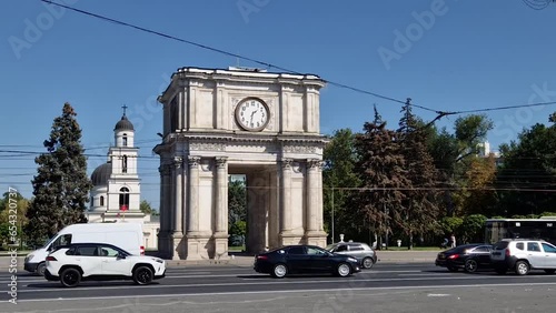 Triumphal Arch and the Metropolitan Cathedral Nativity of the Lord architectural centerpiece of Chisinau city, Moldova. Autumn season view to the landmarks from the Stephen the Great avenue photo
