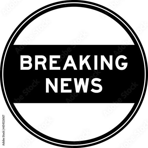 Black color round seal sticker in word breaking news on white background