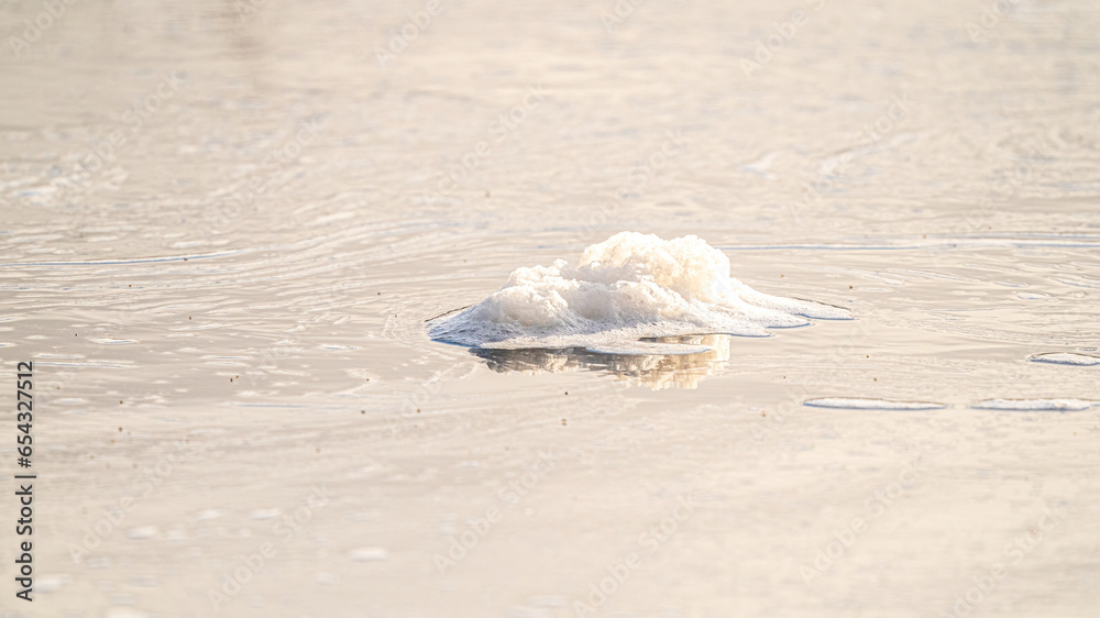 Cold water and ice cubes melting under the sun background. Global warming or climate change concept. Cold therapy, breathing techniques, yoga and meditation. Web banner, panorama