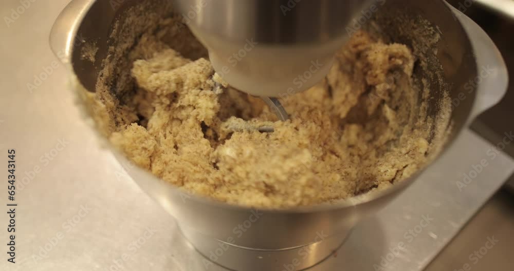 Work of a professional mixer for kneading dough. Preparation of dough in an electric mixer. Modern appliances in the kitchen Work of a professional mixer for kneading dough. Preparation of dough in an electric mixer. Modern appliances in the kitchen