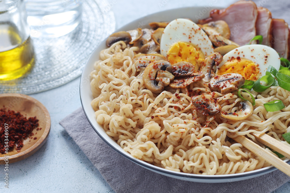 A bowl with ramen, an Asian noodle soup A bowl with ramen, an Asian noodle soup