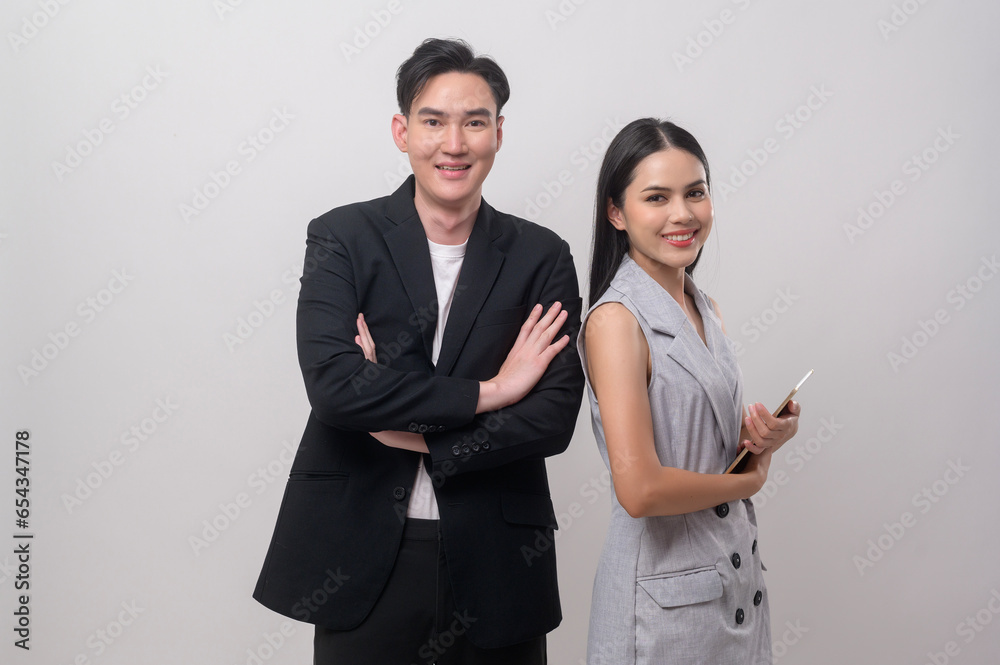 Young Asian couple smiling over white background Young Asian couple smiling over white background