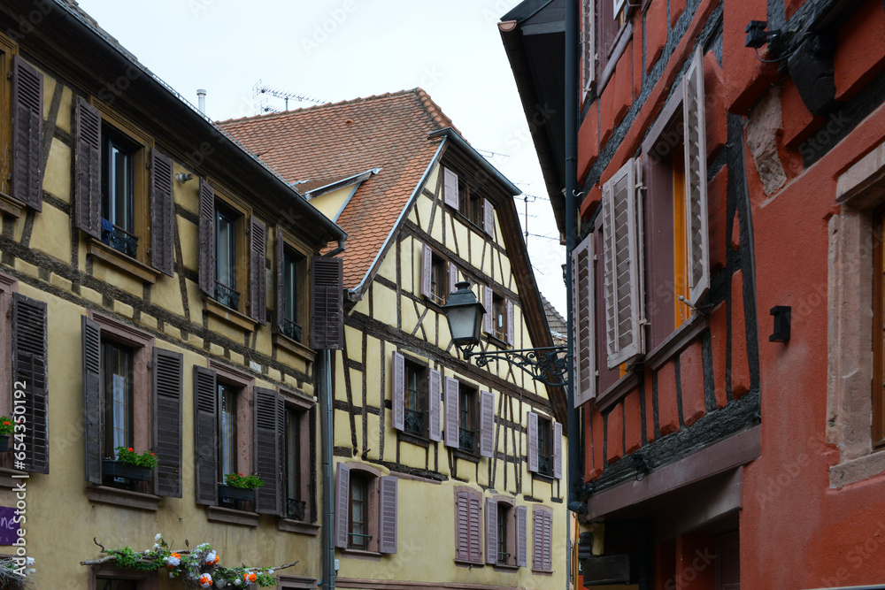 half-timbered houses in narrow street in the old town of Ribeauville in Alsace 