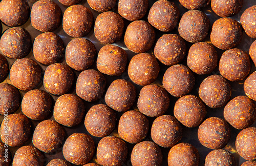 A close up with many boilies for carp fishing photo