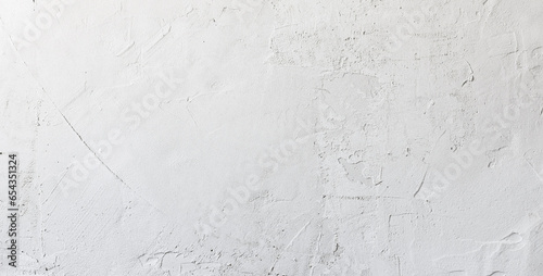 Close up of texture white putty or plaster on the wall, creating a smooth and clean surface for interior finishing. photo