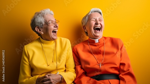 Three Catholic women friends smiling and laughing together, dressed in color, against a colorful background of yellow, blue, orange, green, and red photo