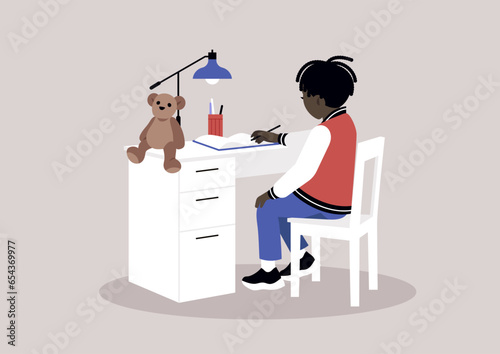 A young African preschool student diligently working on his homework at a desk with drawers, representing the concept of home education