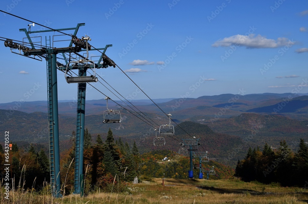 view from top of Mont-Tremblant along the chairlift towards Lake Superior  the Laurentian mountains, Autumn scene
