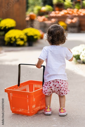 small child / girl with a large shopping basket