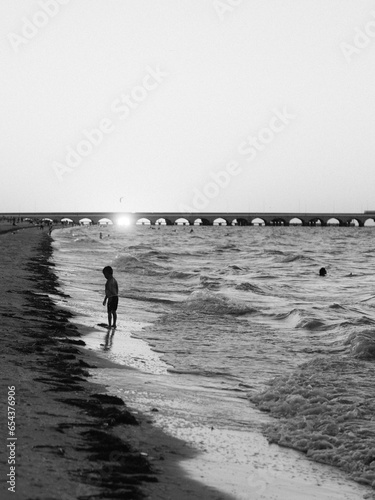 child walking on the beach