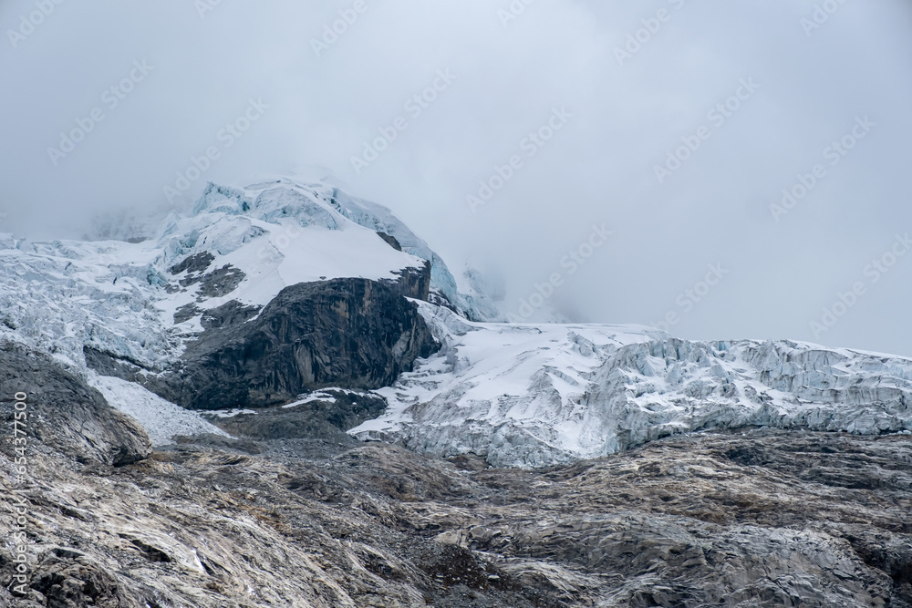 Peak of a mountain with eternal snow and a glacier