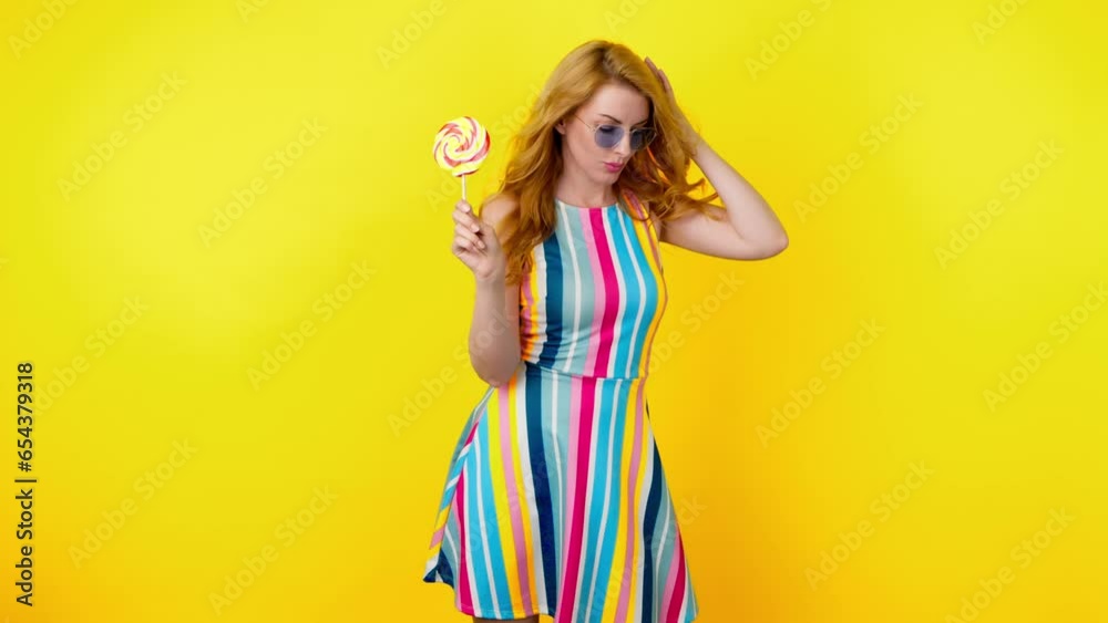 Dancing excited fashionable woman having fun rhythm to music, enjoying life, entertainment. Carefree playful smiling female lady, trend makeup, colorful outfit for ad, fashion, party. Studio on yellow Dancing excited fashionable woman having fun rhythm to music, enjoying life, entertainment. Carefree playful smiling female lady, trend makeup, colorful outfit for ad, fashion, party. Studio on yellow