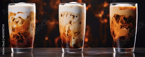 The Nitro cold brew swirls tantalizingly in a glass, enticing you to embrace its smooth charm. As the nitrogen bubbles rise, they leave behind trails of intricate patterns, inviting you