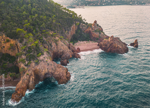 Massif de l'Esterel -Theoule sur Mer -Pointe de l'Aiguille. Esterel Mediterranean coast of red rocks, beach and sea. French Riviera on the Côte d'Azur photo