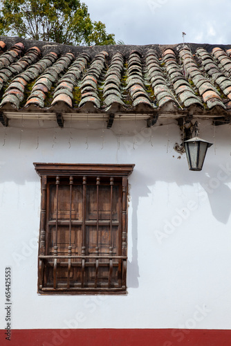 Fototapeta Naklejka Na Ścianę i Meble -  Detail of the beautiful colonial architecture of the streets of the colonial small town of Iza located in the Boyaca department in Colombia