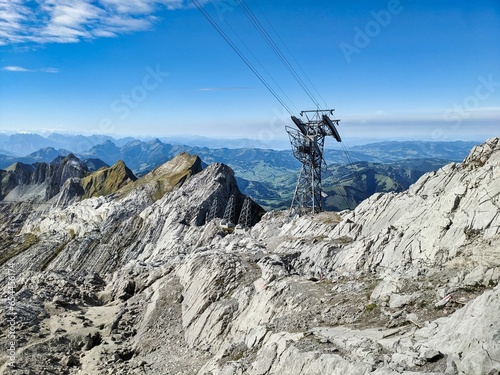 Hike to the Säntis in the Alpstein Appenzell. Beautiful autumn weather with a view of the stütze 2 of the air cable car. Excursion destination in Eastern Switzerland. High quality photo