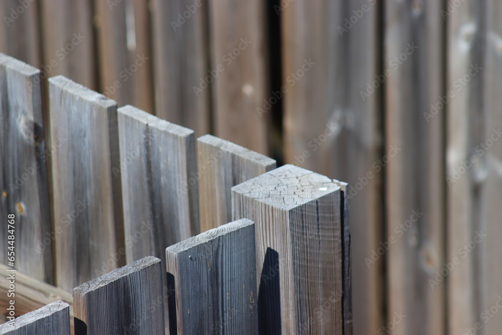 Wooden fence from boards, boards background Wooden fence from boards, boards background