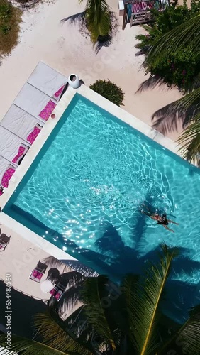 Aerial View of women in swimming pool in Zanzibar
