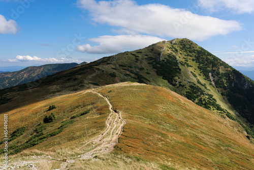 Velky Krivan, Mala Fatra, Slovakia. View from Pekelnik mountain. Beautiful grassy mountain landscape in late summer. Sunny weather with blue sky. photo