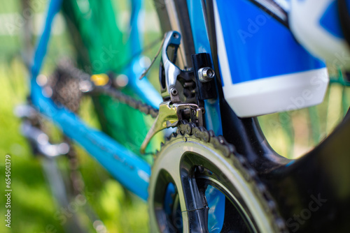professional sport bike closeup of sprocket and chain, selective focus