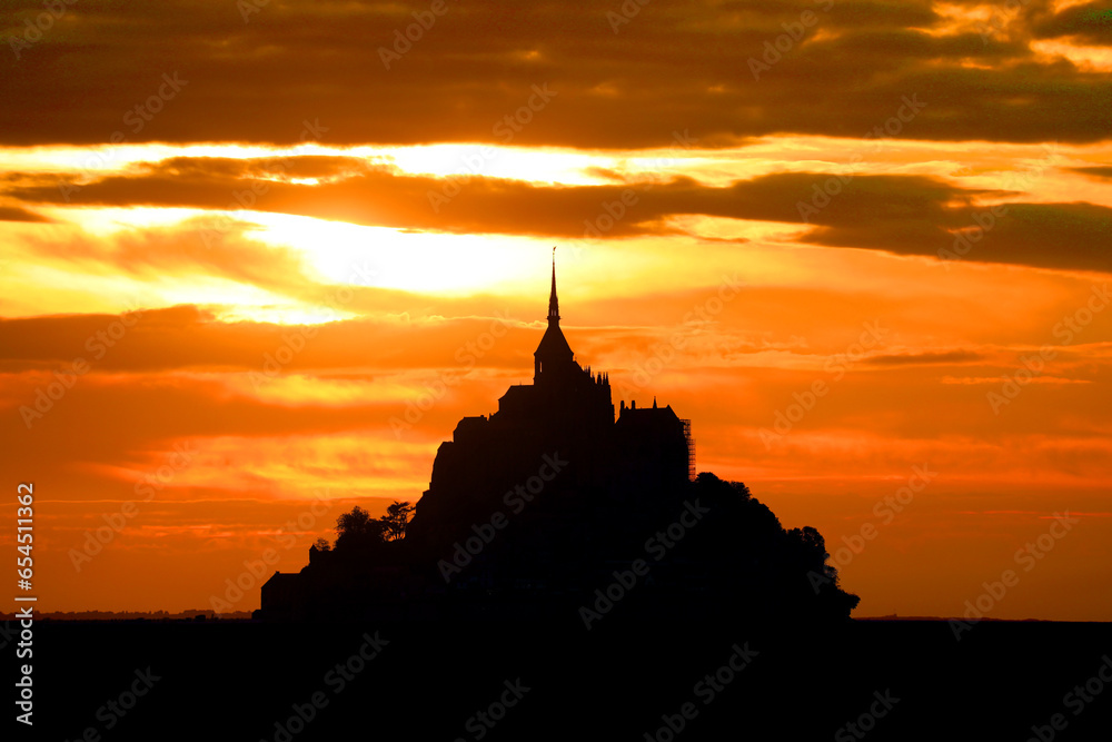Breathtaking View with Abbey of Mont Saint Michel in France at sunset