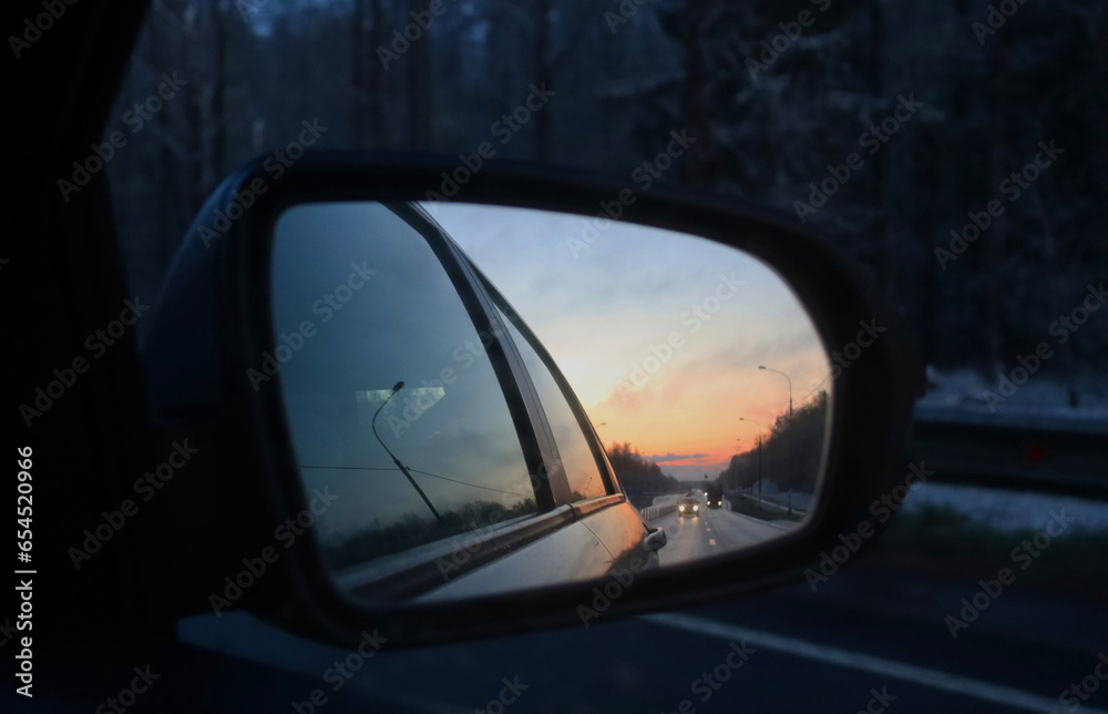 Sunset in a car side mirror. Eternity