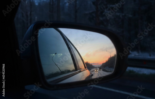 Sunset in a car side mirror. Eternity