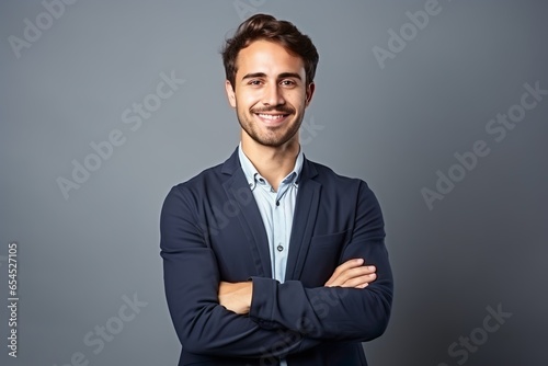 Happy Smiling Man: Confident Businessman Standing with Crossed Arms - Studio Portrait - Testimonial of Beauty, Joy, and Authenticity © Konrad