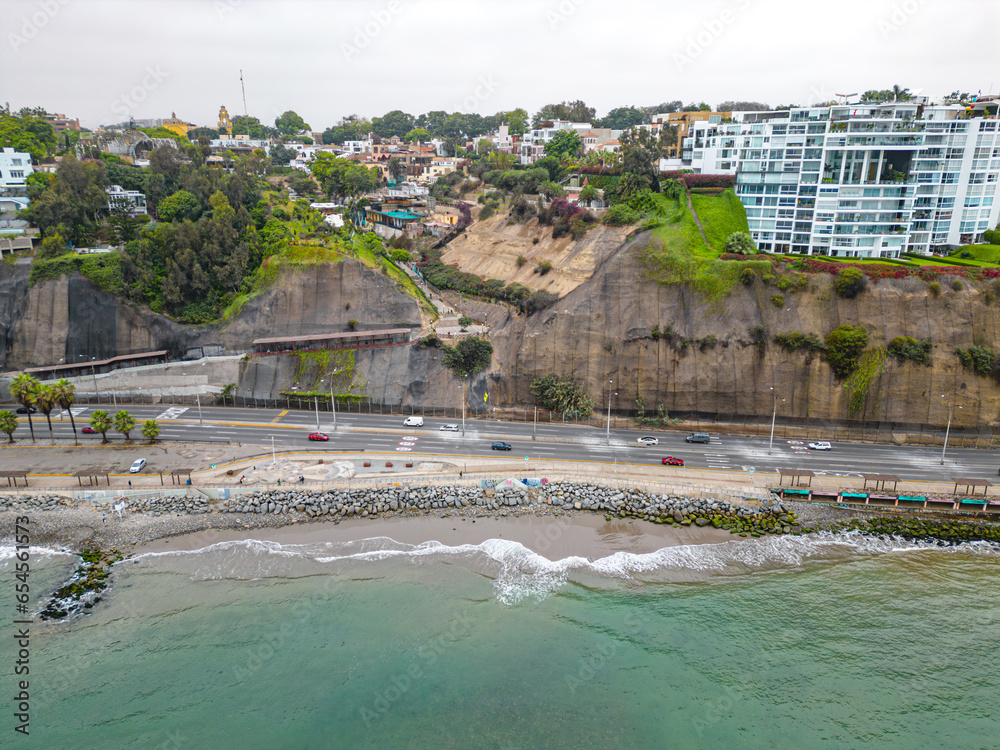 Aerial image of Miraflores, Lima. Peru. Cloudy day with rain, strong waves and dramatic sky.