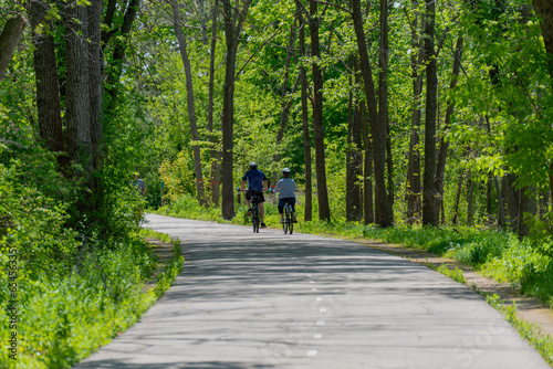 People Enjoying A Spring Bicycle Ride On The Fox River Trail Near De Pere, Wisconsin