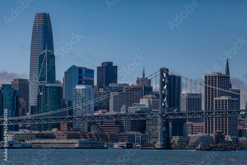 View from water of the San Francisco Bay Bridge in front of the Embarcadero and SF skyline on a clear day