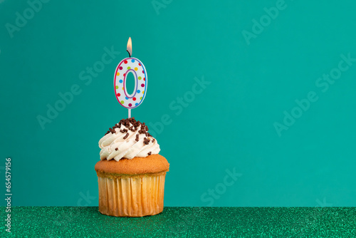 Birthday candles on green background.Birthday CupCake on bright green