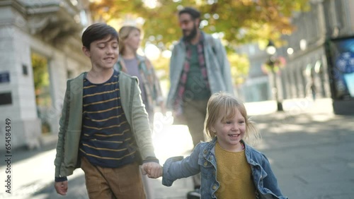 Young family having fun and walking in the city