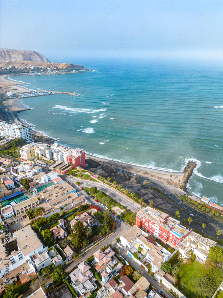 Barranco, Lima, Peru. September 25, 2023. Malecón de Barranco Park region with luxury houses on stone hillside next to the Pacific Ocean. Concept houses and buildings next to the ocean.