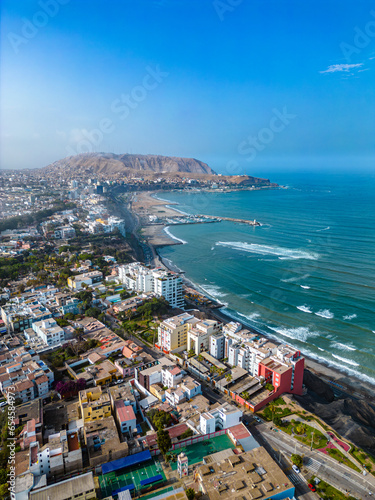 Barranco, Lima, Peru. September 25, 2023. Malecón de Barranco Park region with luxury houses on stone hillside next to the Pacific Ocean. Concept houses and buildings next to the ocean.