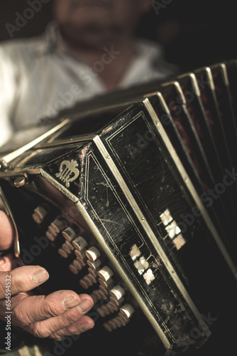 Foto Closeup of a black bandoneon in the process of playing