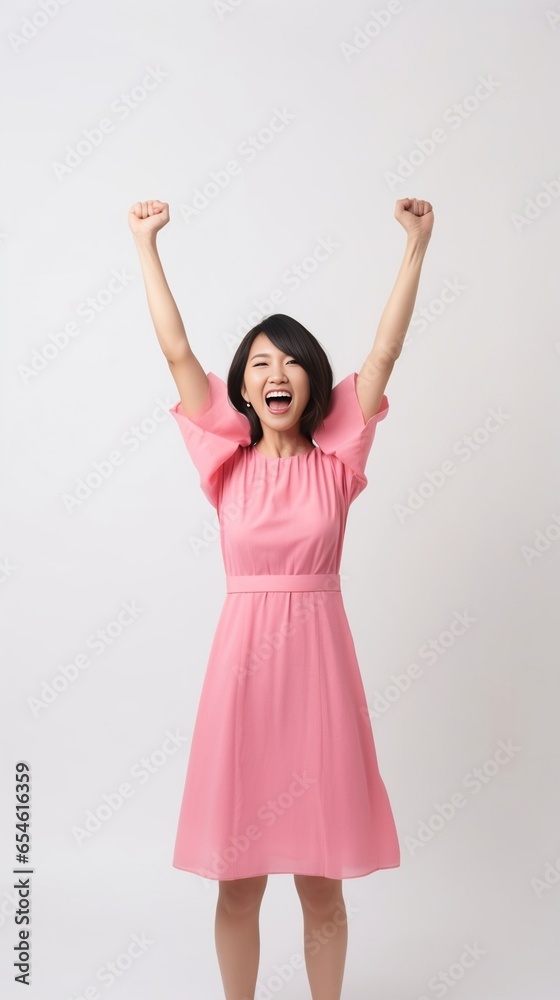 So happy Excited young smiling woman in pink bunny ears clapping and looking at camera while standing against grey background : Generative AI So happy Excited young smiling woman in pink bunny ears clapping and looking at camera while standing against grey background : Generative AI