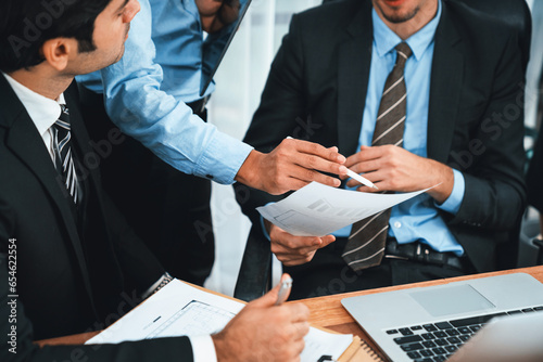 Group of business people working together exchanging ideas and interactive teamwork concept in business meeting room. Team of business professional discussing new strategy and marketing. Habiliment