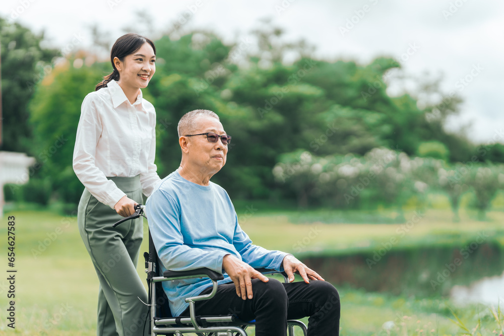 Asian people elderly man on wheelchair with caregiver nurse outdoor, , exemplifying the essence of holistic well-being and compassionate support. Nature Therapy Asian people elderly man on wheelchair with caregiver nurse outdoor, , exemplifying the essence of holistic well-being and compassionate support. Nature Therapy
