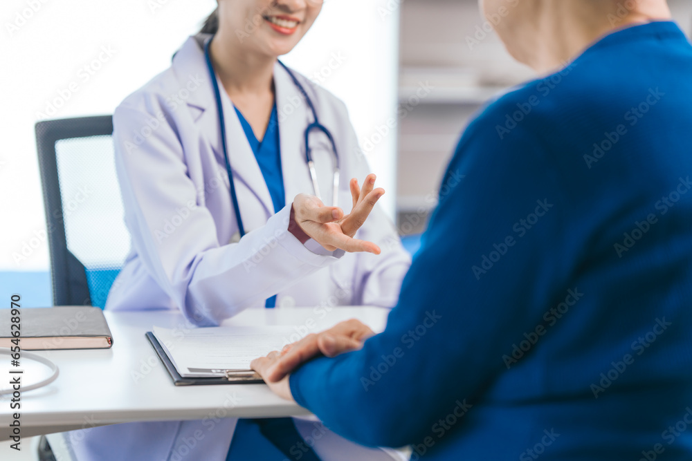 Asian people experienced female doctor giving advice to elderly male patient cancer and x-ray results and treatment options, Cancer Consultation, Elderly Man Receives Expert Cancer Advice Awareness - obrazy, fototapety, plakaty 