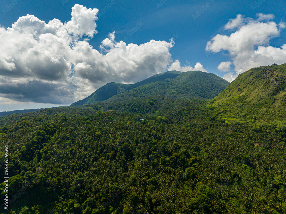 Aerial view of mountain landscape with green hill and forest. Camiguin Island. Philippines. Aerial view of mountain landscape with green hill and forest. Camiguin Island. Philippines.