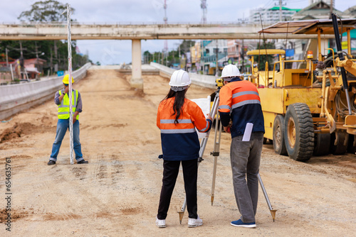 Engineer use theodolite equipment for route surveying to build a bridge