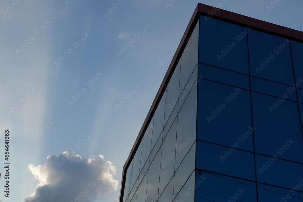 glass buildings with cloudy blue sky background glass buildings with cloudy blue sky background